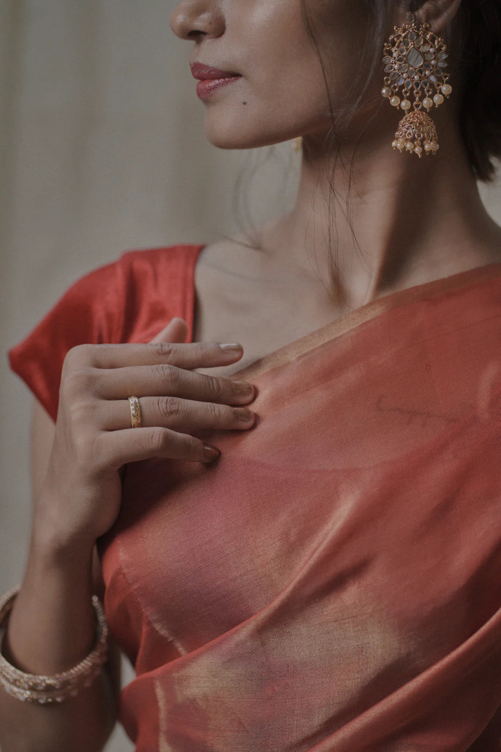 red tissue silk saree in gold zari