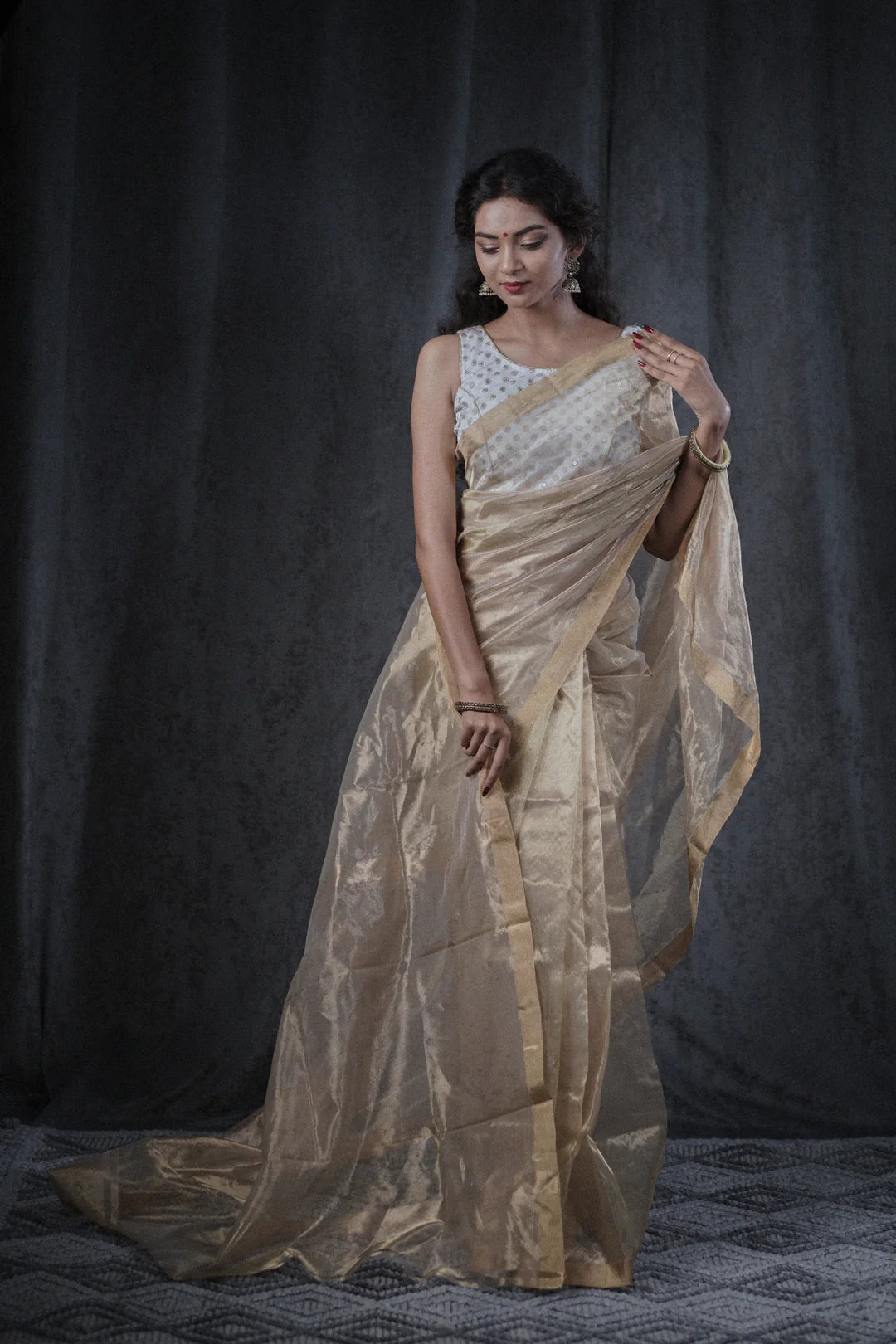 beige tissue saree with gold zari