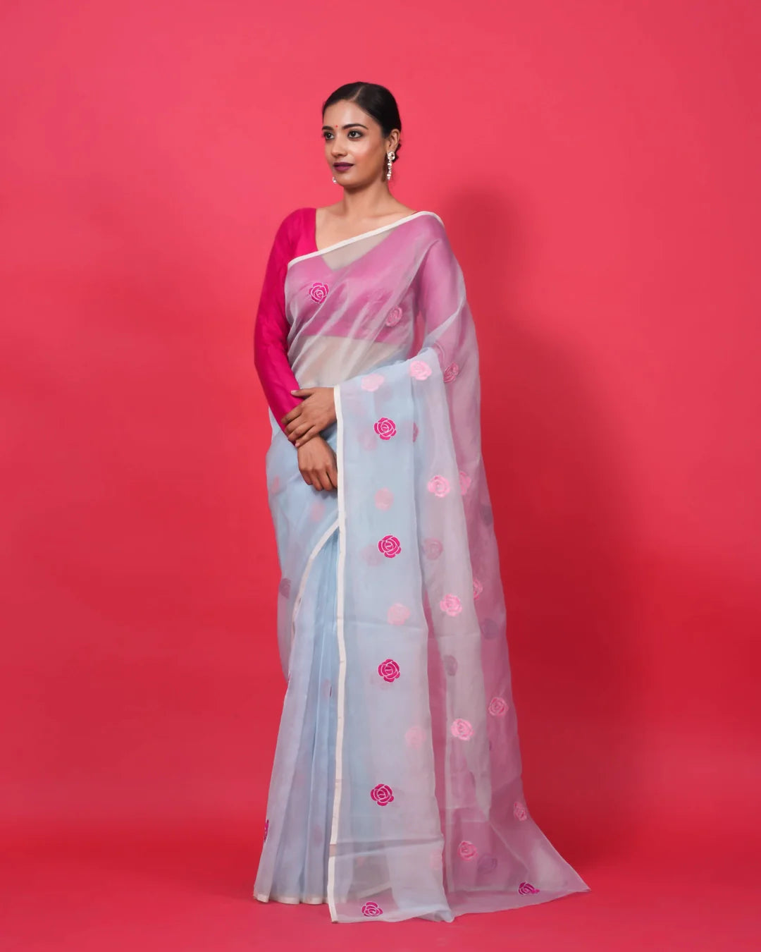 blue organza silk saree with pink resham roses